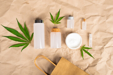 Fototapeta na wymiar natural marijuana oil cosmetics set, cannabis kit with beauty skin care flat lay