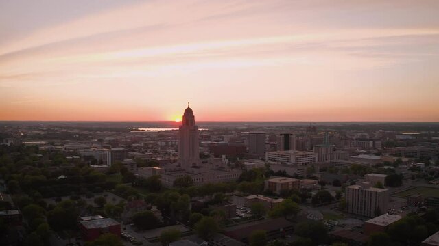 Nebraska State Capitol building and Lincoln Nebraska skyline at sunset