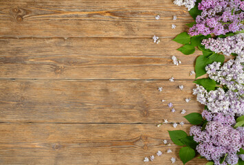 Lilac flowers on old wooden table, floral background. Copy space