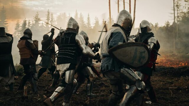 Epic Battlefield: Armies of Medieval Knights Fighting with Swords. Dark Age War, Crusade, Conquest. Action Battle of Armored Warrior Soldiers, Brutal Enemy Killing. Cinematic Historical Reenactment