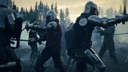 Epic Battlefield: Armies of Medieval Knights Fighting with Swords. Dark Ages Warfare. Action Battle of Armored Warrior Soldiers, Killing Enemies. Blue Cinematic Historical Reenactment. Slow Motion