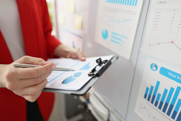 Business charts for business analytics in female hands