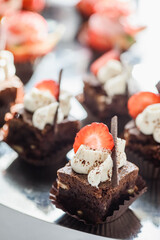 luxury wedding catering, table with modern desserts, cupcakes, sweets with fruit. High quality photo