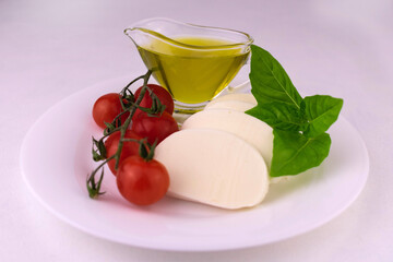 Ingredients for caprese salad isolated on white background.