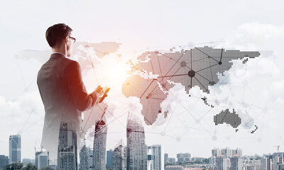 Concept of business success and control with confident boss against cityscape background