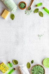 Frame of green aroma spa tea tree cosmetics with essential oil