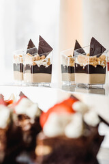 luxury wedding catering, table with modern desserts, cupcakes, sweets with fruit. High quality photo