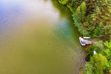 Aerial view yacht on lake in Tuchola Forests, Poland.