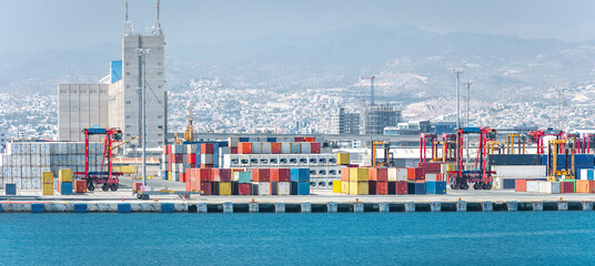 Container yard with straddle carriers and other facilities in cargo terminal of Limassol port,...