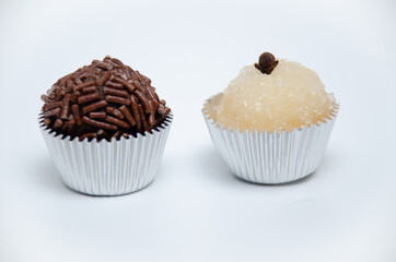 Brigadeiro and Beijinho. Typical Brazilian sweets made with condensed milk, the first with cocoa and the second with coconut.