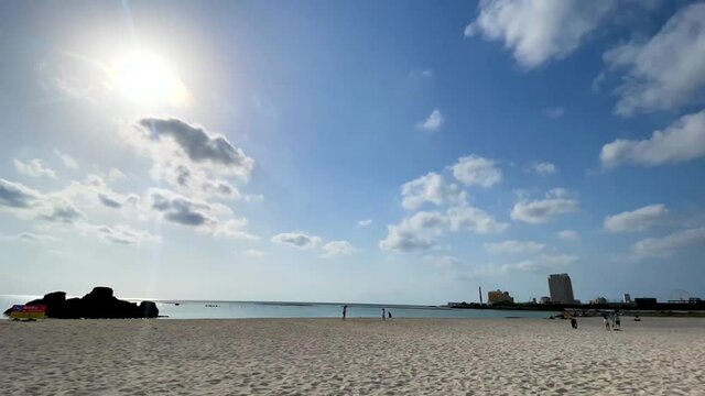 CHTAN-CHO, OKINAWA, JAPAN - JUNE 2021 : View of Araha beach (Ocean or sea). Wide view time lapse shot in daytime. Holiday, vacation and resort concept shot.