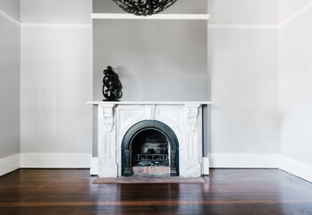 traditional open fireplace with marble surround