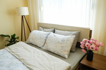 Minimal interior of bedroom with freshly made king sized bed, perfectly clean and ironed sheets,...