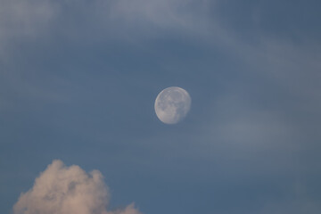 Moon over the clouds at morning.