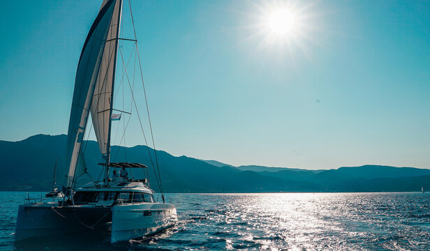 boat, sea, yacht, water, sail, sailboat, ocean, sailing, ship, sky, summer, travel, vacation, catamaran, horizon, holiday, nature, cruise, lake, vessel, beach, leisure, boats, wind, recreation, nautic