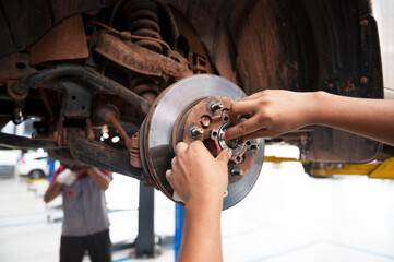 Wheel bearings change the mechanics of car service concepts in automobile center showrooms.
