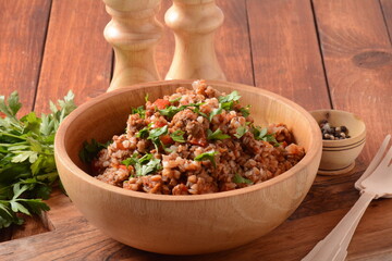 Buckwheat porridge with beef meat and vegetables. Russian cuisine