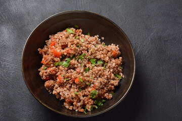 Buckwheat porridge with beef meat and vegetables. Russian cuisine
