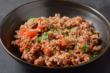 Buckwheat porridge with beef meat and vegetables. Russian cuisine