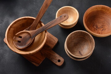 Culinary background, empty ceramic plates, wooden or bamboo spoons and bowls   . Rustic style. Home Kitchen Décor.