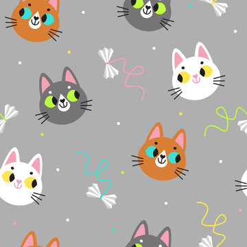 Seamless vector pattern with cute cats faces and cat toys on the grey background. Flat pattern with cats faces icons. Kids pattern for clothes, wrapping paper, notebook covers, etc.