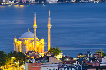 Istanbul, Turkey, July 12, 2021. Ortakoy wharf, ships on the Bosporus. Night city view, Ortakoy Mosque, Bosphorus, and the Asian side