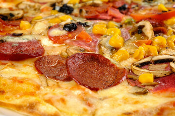 Mixed pizza on a white background.