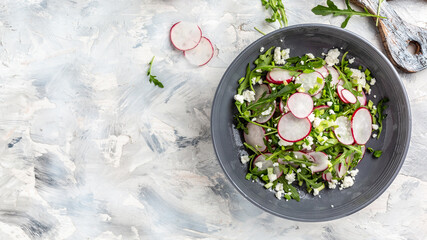 Fresh summer salad with radishes in the bowl. Detox and healthy superfoods bowl concept