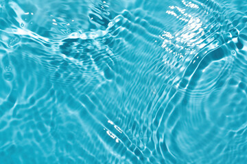 Blurred water background De-focused transparent. Blue texture with waves.