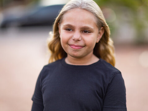 head and shoulders of ten year old aboriginal child with blonde hair