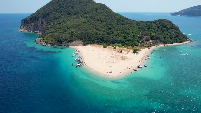 Aerial view to the popular beach of Marathonisi or Turtle island in the bay of Laganas, Zakynthos, Greece