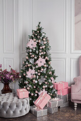 Fototapeta na wymiar Christmas tree and white and pink decor.