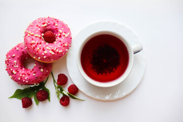 sweet dessert. round donuts with pink icing isolated on white background and raspberries 