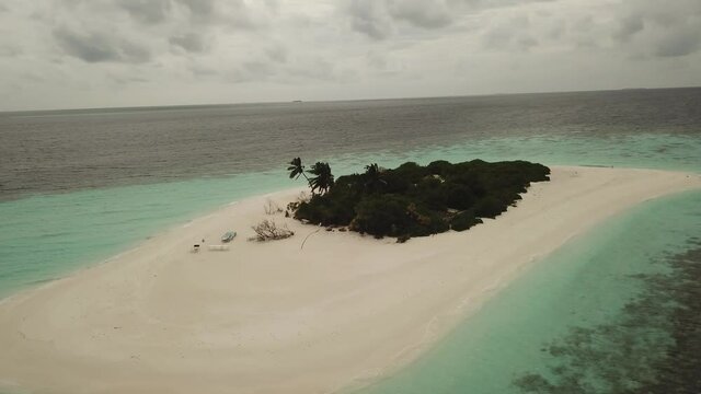 Aerial  Drone Tropical Island on the Maldives with white beaches and azure blue water