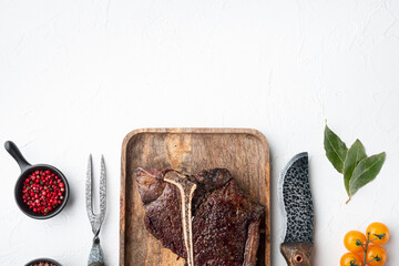 Roast t-bone or porterhouse beef meat Steak, on wooden tray, top view flat lay, with copy space for...