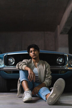 Young latin man in parking lot