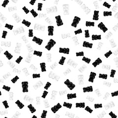 Seamless pattern of black and white gummy bears on a black background