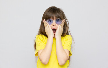 Portrait of funny emotional young female wearing glasses and shirt popping eyes out, exclaiming in astonishment and surprise, saying Wow, Omg, This is amazin Human reaction, feelings and attitude