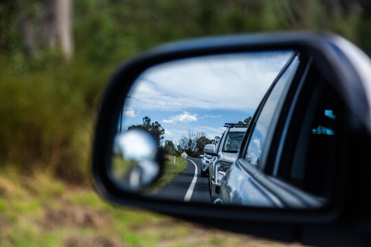 Backed up traffic in car side mirror