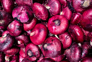 Red onion background. Vegan banner. Vegetables wallpaper.