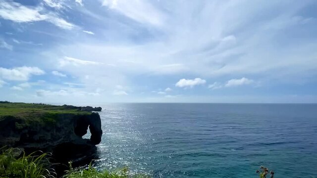 OKINAWA, JAPAN - JUNE 2021 : Cape Manzamo located near Onna son village in the Kunigami District. Wide view time lapse shot in daytime.