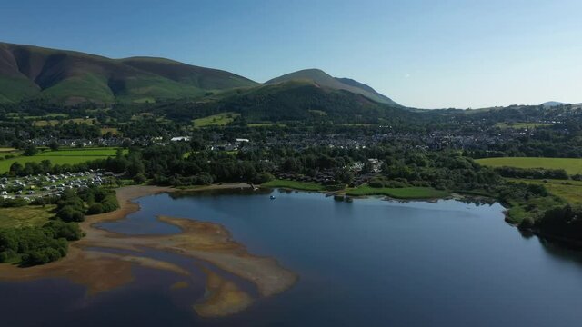 4K:  Drone Aerial Clip of Derwentwater approaching Keswick in the English Lake District, Cumbria, UK. Summer with Blue Sky. Stock Video Clip Footage