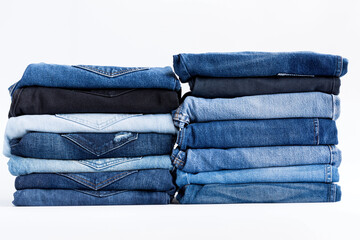 Blue torn denim jeans texture on white background at wall store and supermarket.concept fashion jeans..