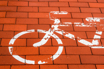 Red brick bike path. Wet bicycle path. The sidewalk after the rain. Bicycle markings. © SeagullNady