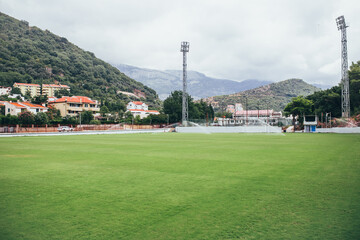 Petrovac, Montenegro - August 18, 2020: Provincial stadium in the mountains by the sea - a cozy city