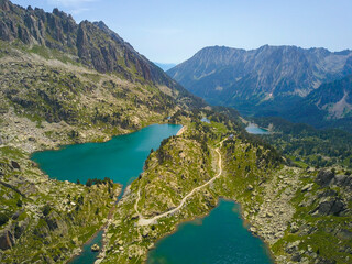 Aerial view of a wild lake in the middle of the high mountains of pyrenees.