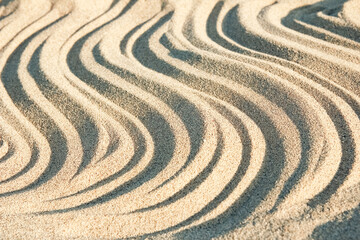 Fototapeta na wymiar beautiful drawings on the sand of the sea shore