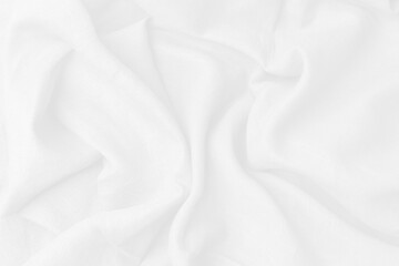 Cotton textile is wave beautiful  for wallpaper. Top view white fabric luxurious softness smooth on white background with copy space. Design textured, abstract, background.