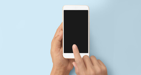 Hand holding smartphone device touching screen