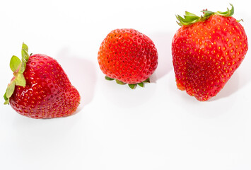 Red strawberry isolated on white background.